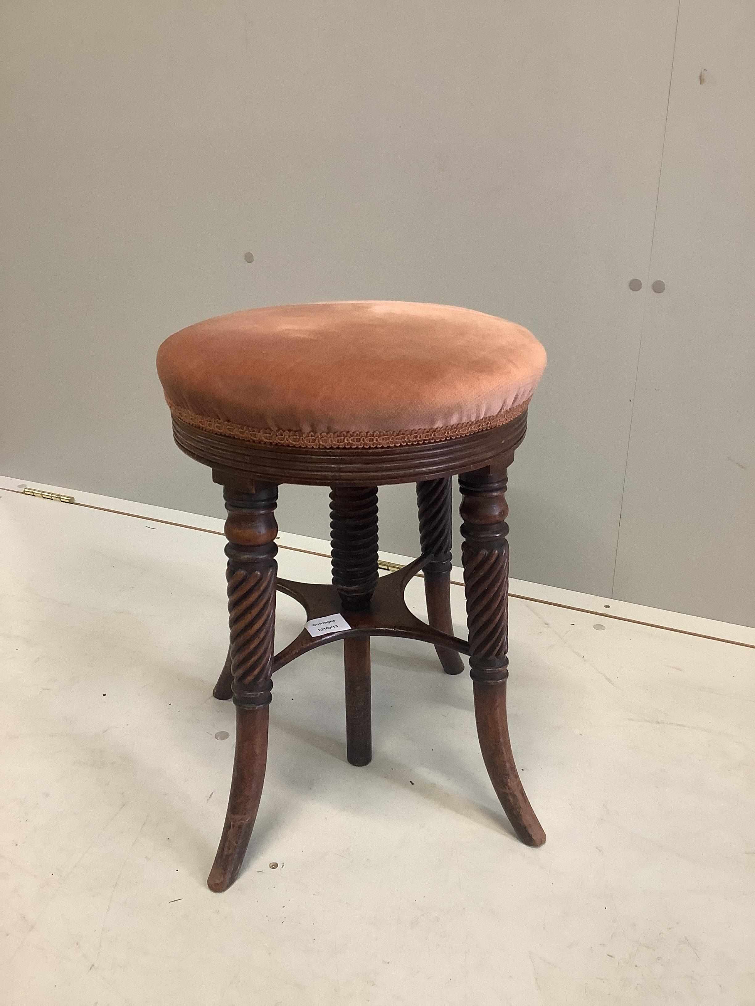 A Regency mahogany circular adjustable piano stool, diameter 35cm, height 46cm